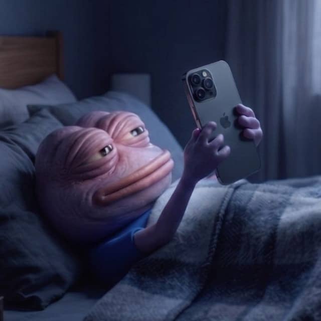 Frog doomscrolling in bed at night, illuminated by the glow of a phone screen